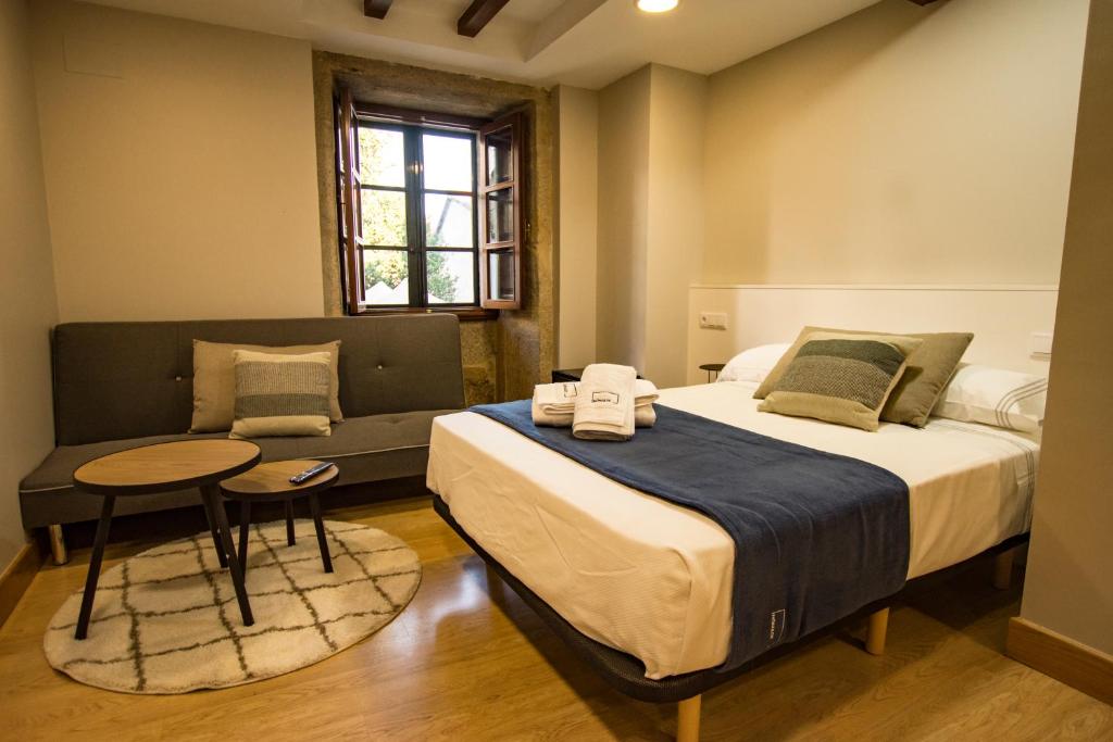 Cama ou camas em um quarto em hostal Nomade Santiago