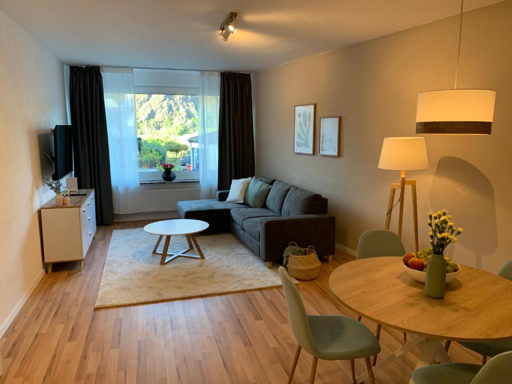 a living room with a couch and a table at Apartment Brauselay in Cochem