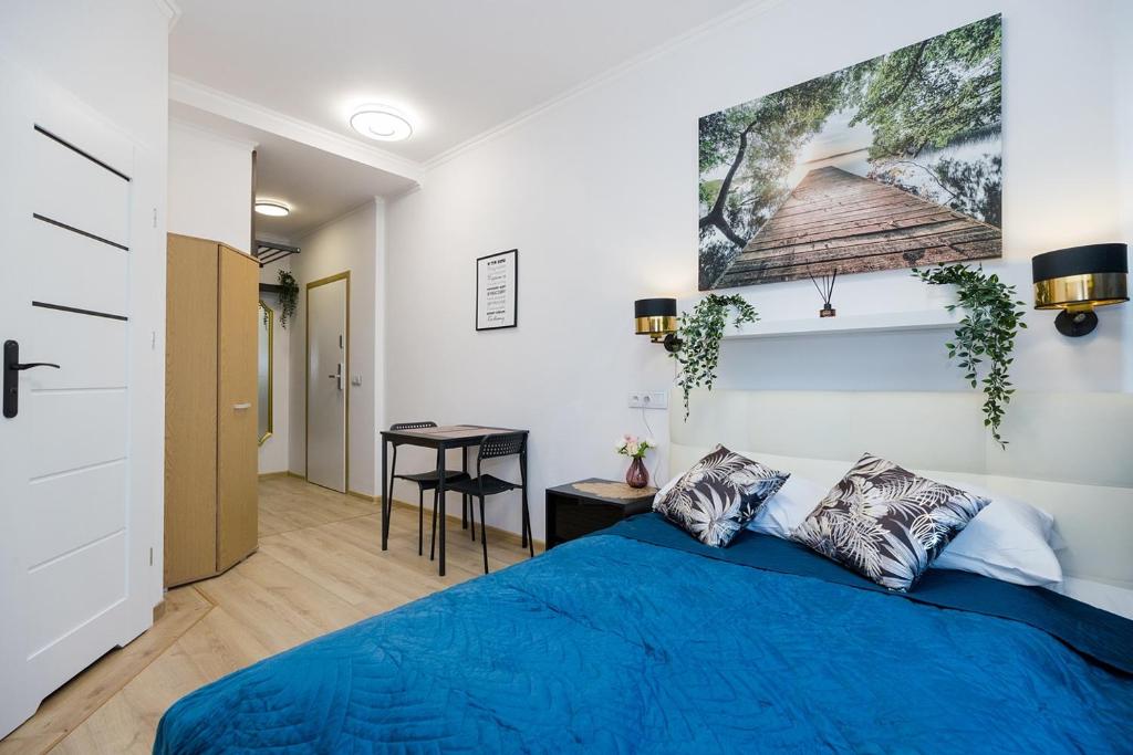 En eller flere senger på et rom på Stadion Narodowy Warszawa UNIT ApartmentMini noclegi Super lokalizacja przy Metro MiniStudio with private banthroom