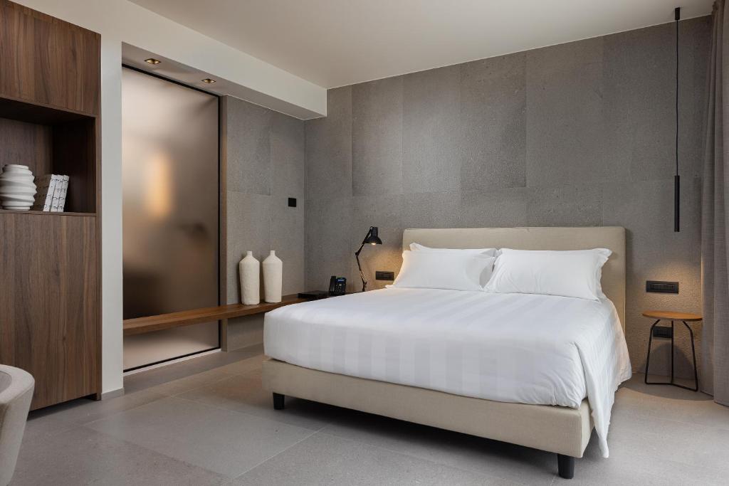 A bed or beds in a room at B21 Lifestyle Hotel