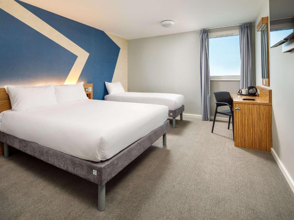 Giường trong phòng chung tại ibis budget London Heathrow Central