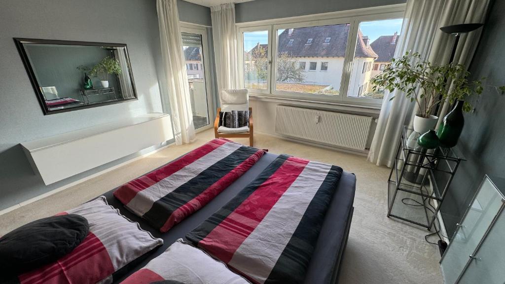 Krevet ili kreveti u jedinici u okviru objekta Monikas Home - Gemütliche 3-Zimmer-Wohnung im Herzen von Böblingen