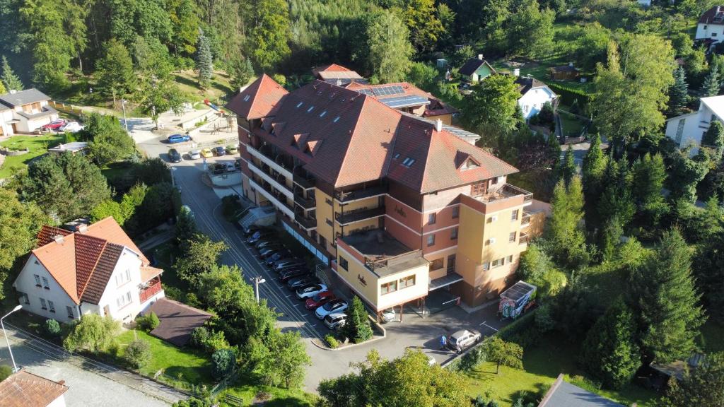 an aerial view of a building in a small town at Hotel Ambra in Luhačovice