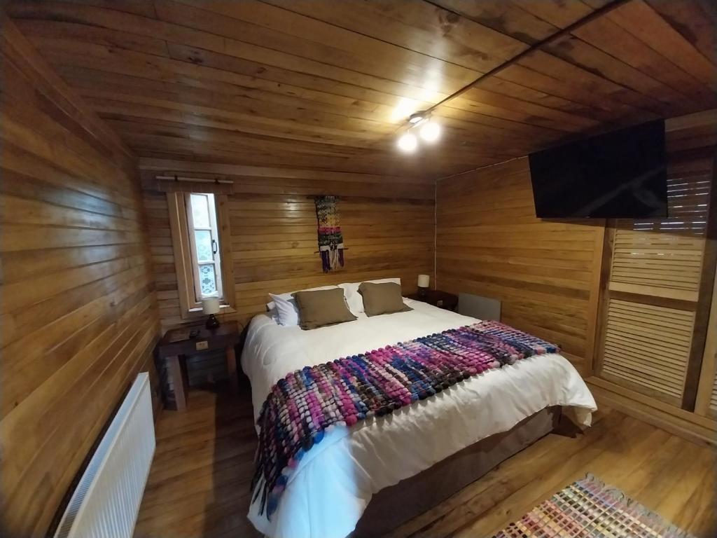 A bed or beds in a room at ALMA CHILOTA