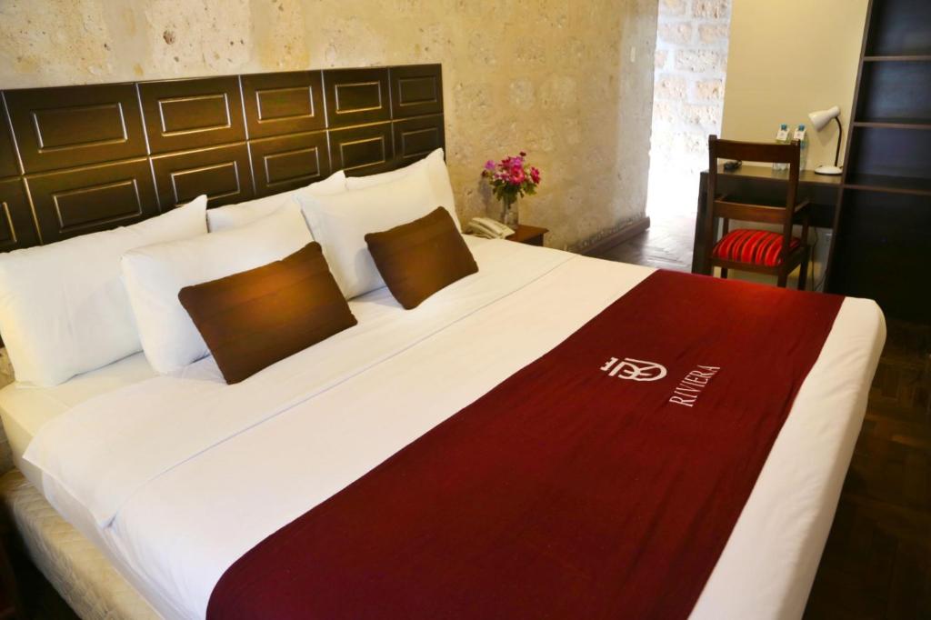 Giường trong phòng chung tại Hoteles Riviera Colonial