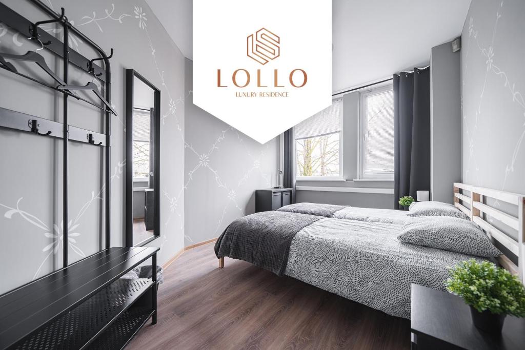 A bed or beds in a room at Lollo Motel Graičiūno - Lollo Luxury