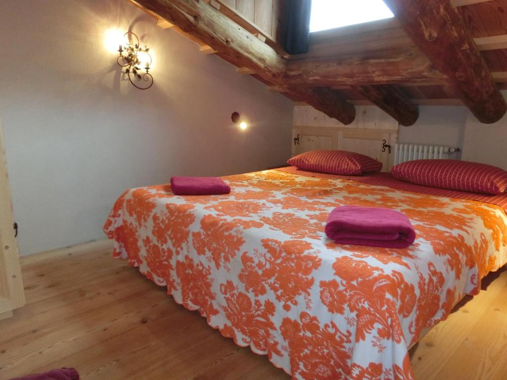 Cama ou camas em um quarto em CORTINA Lodge