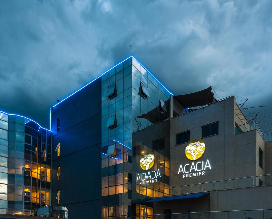 Et logo, certifikat, skilt eller en pris der bliver vist frem på Acacia Premier Hotel