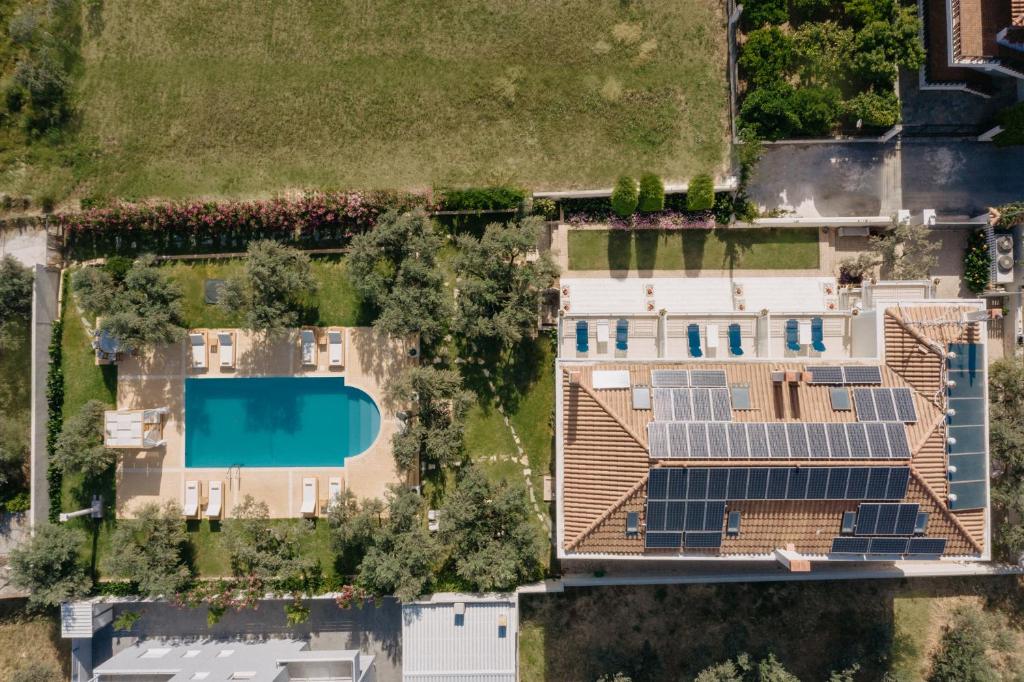 an overhead view of a house with solar panels on its roof at Nereides Luxury Villas in Káto Almirí