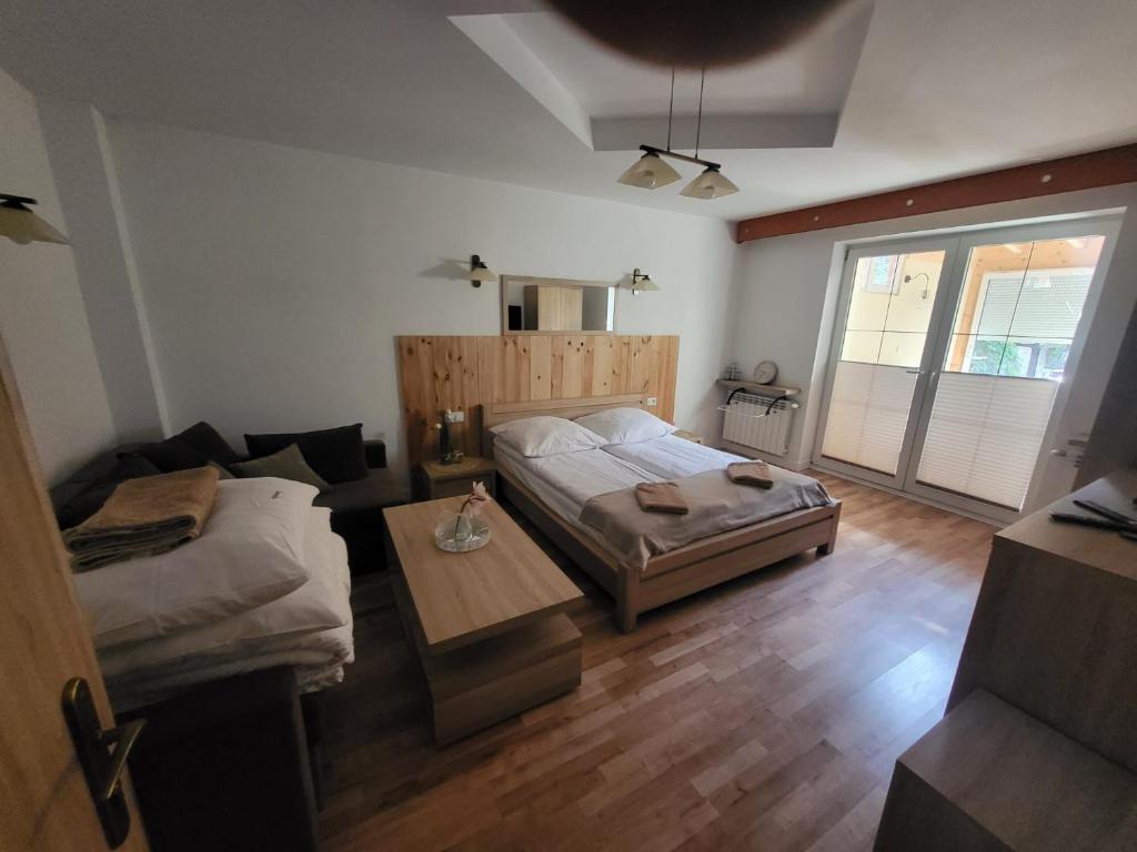 Krevet ili kreveti u jedinici u objektu Apartament pod Basztą