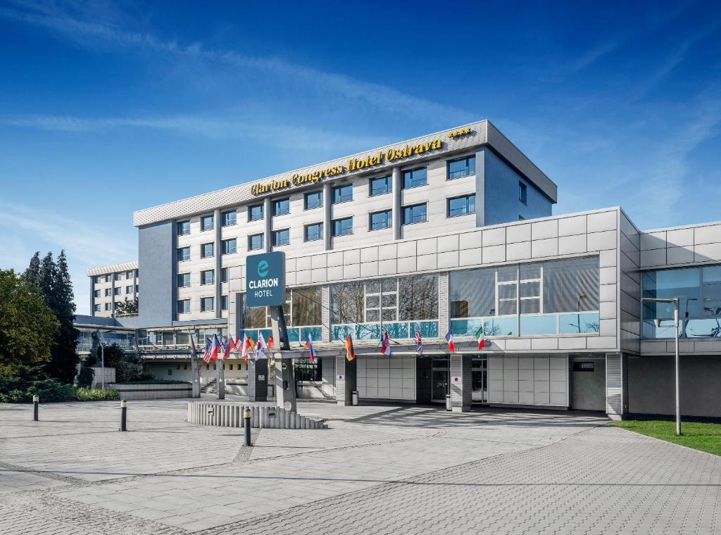 a large building with a sign on top of it at Clarion Congress Hotel Ostrava in Ostrava