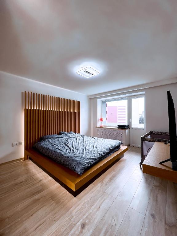 Posteľ alebo postele v izbe v ubytovaní Cozy Retreat Apartment