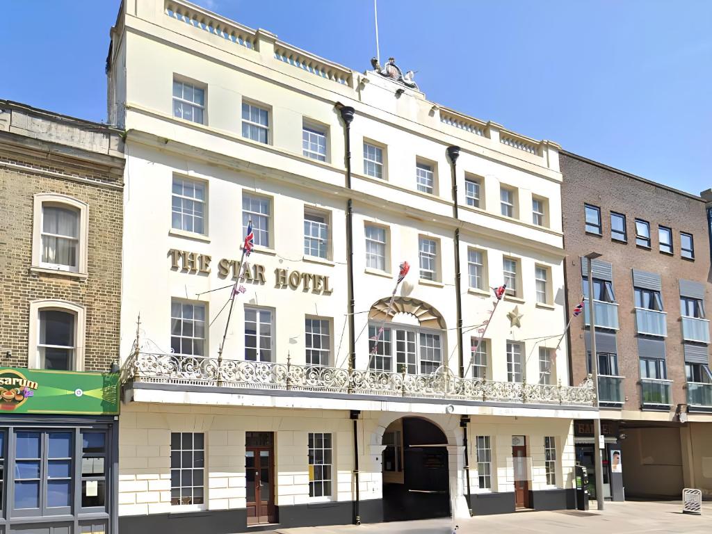 a large white building with a balcony at The Star Hotel in Southampton