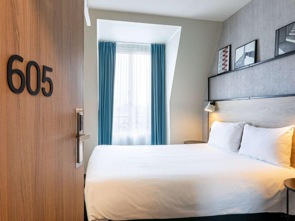 En eller flere senge i et værelse på ibis Paris Boulogne Billancourt