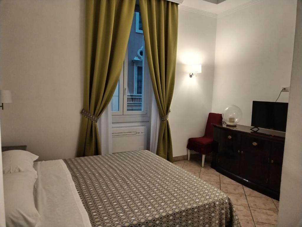 Postelja oz. postelje v sobi nastanitve B&B L'Esquilina