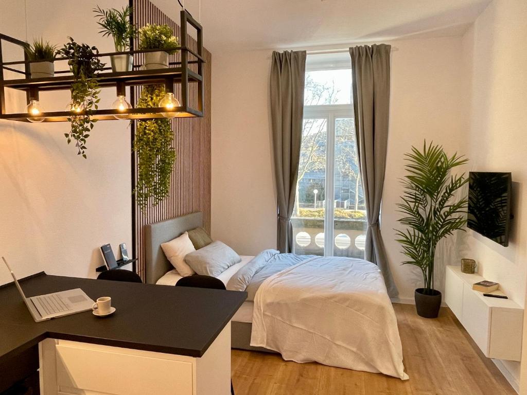 Vuode tai vuoteita majoituspaikassa Modernes Apartment im Zentrum von Karlsruhe