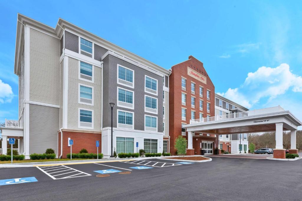 a rendering of the front of a hotel with a parking lot at Hampton Inn Cape Cod Canal in Buzzards Bay