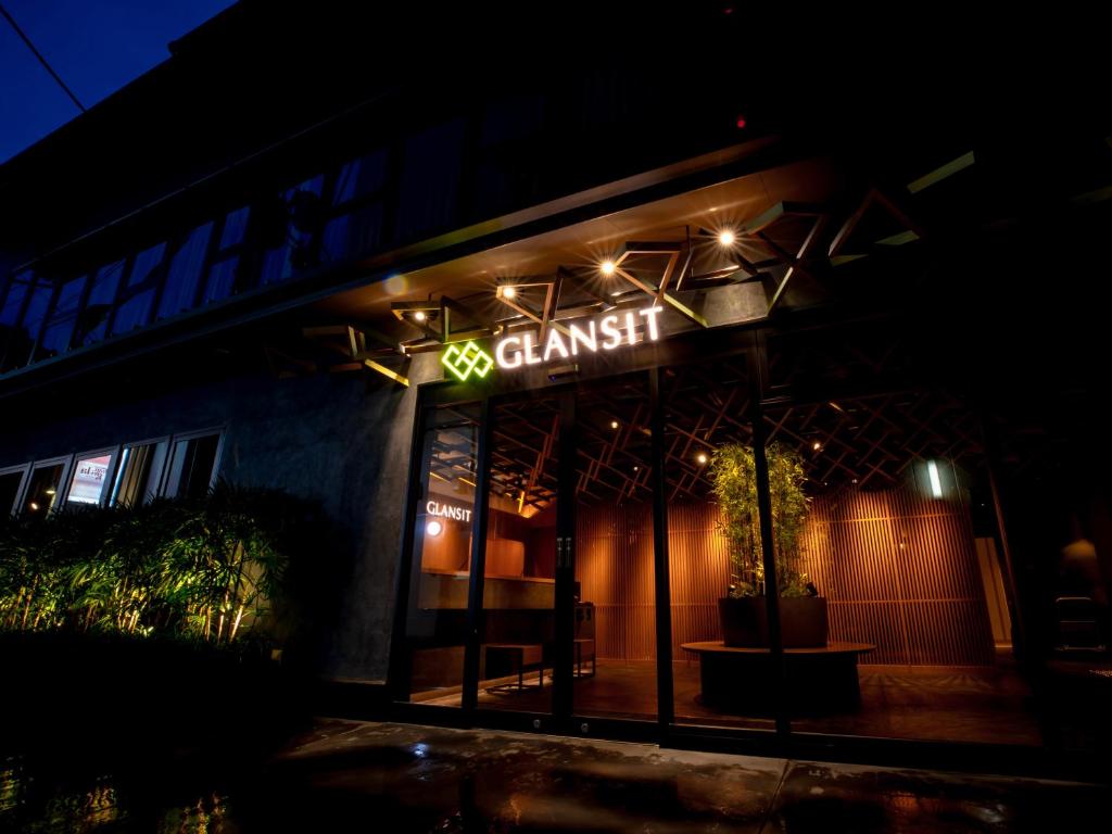 a sign on the front of a restaurant at night at Glansit Kyoto Kawaramachi in Kyoto