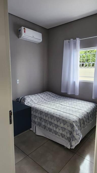 Postel nebo postele na pokoji v ubytování Apartamento/Kitnet