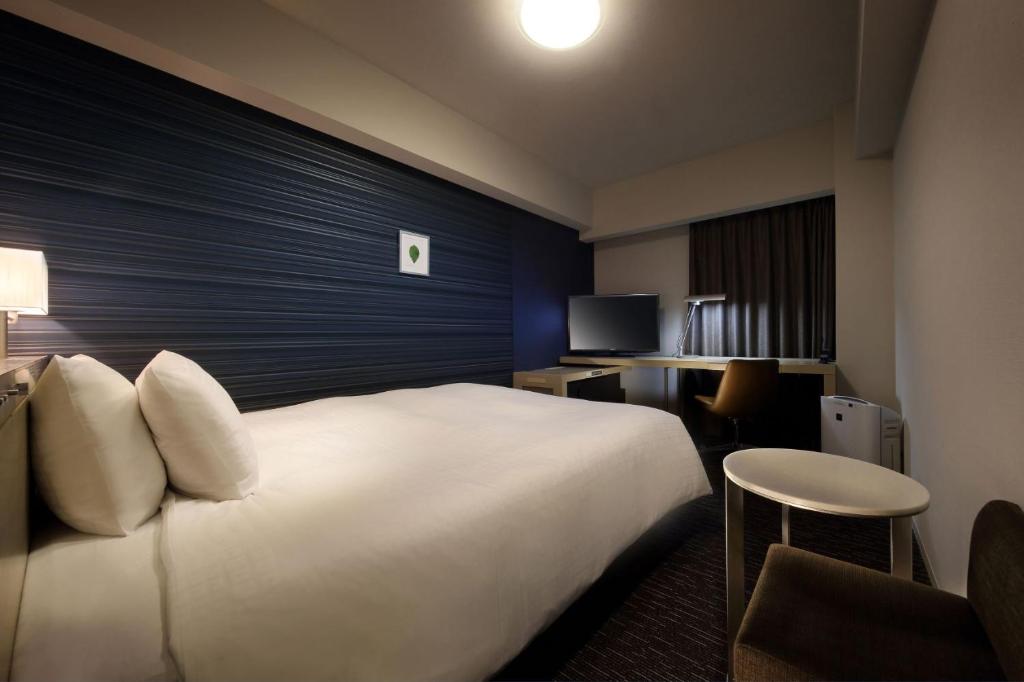 Cama ou camas em um quarto em Richmond Hotel Fukushima Ekimae