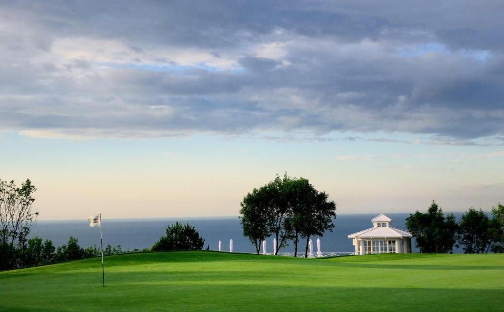 a golf course with a gazebo on a green at Luxury Lighthouse Golf Villa in Balchik