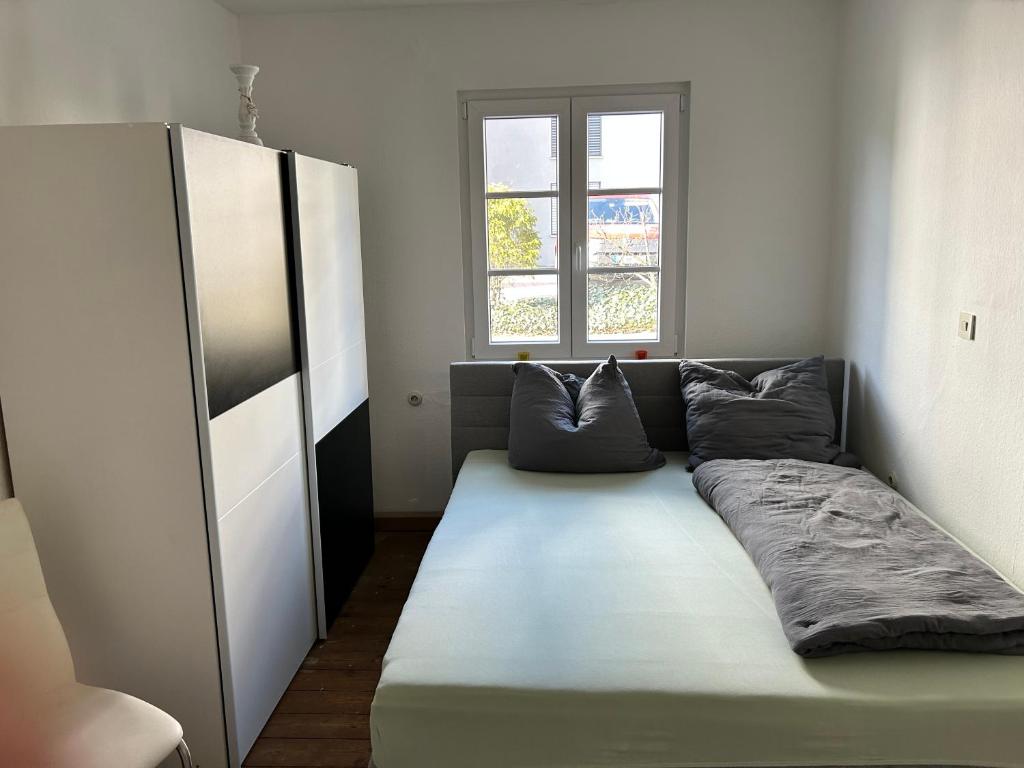 a large couch in a room with a window at Ferienwohnungen Jakobsberg in Bamberg