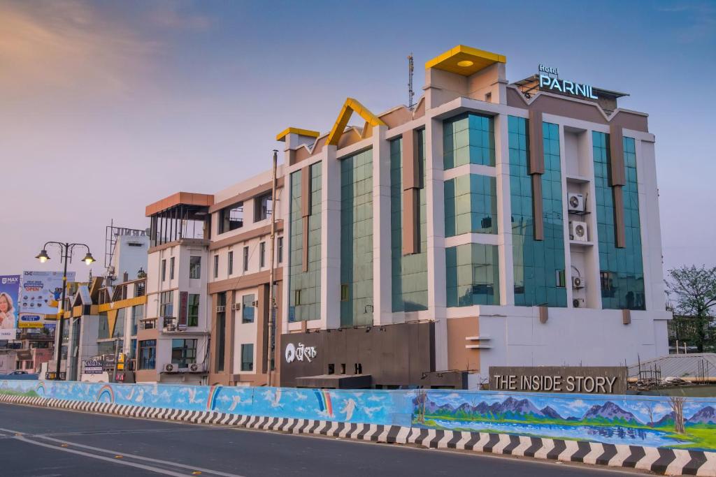 a building on the side of a city street at Parnil Palace in Guwahati