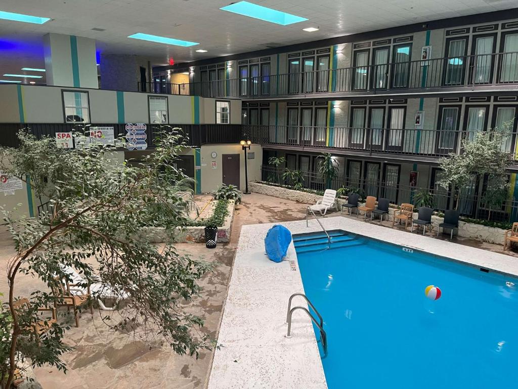 an indoor pool in a hotel with a building at Studio 6 Suites Amarillo, TX West Medical Center in Amarillo