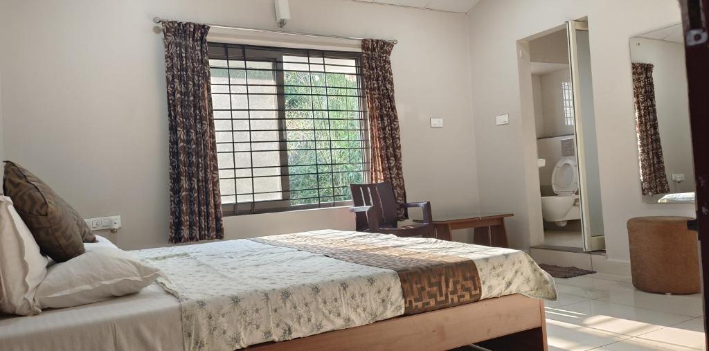 A bed or beds in a room at Sugamya Farm Guesthouse