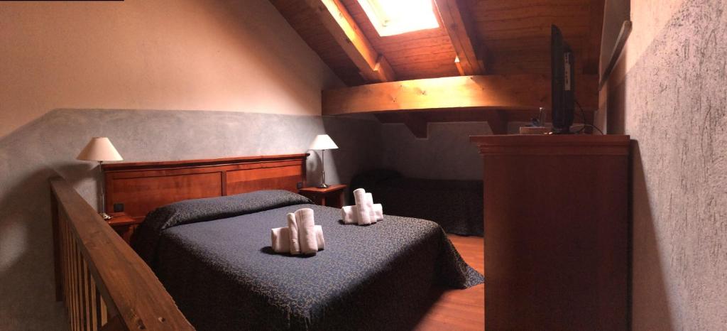 Ein Bett oder Betten in einem Zimmer der Unterkunft Hotel Clari