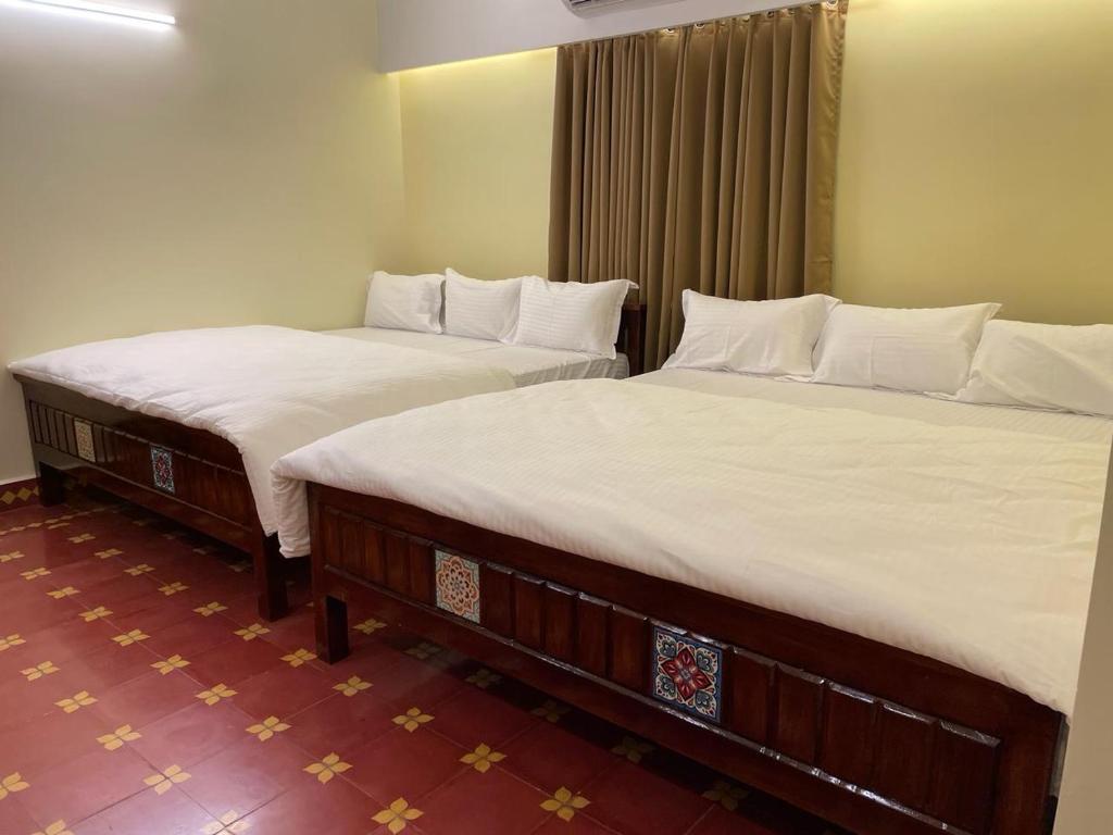 Un pat sau paturi într-o cameră la Viswa Residency Srirangam - Heritage Rooms