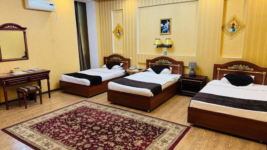 ORIYO DUSHANBE HOTEL में एक कमरे में एक या कई बेड