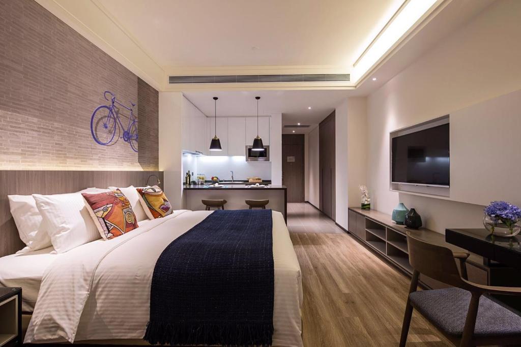 Ліжко або ліжка в номері Citadines Aparthotel Gaoxin Xi'an