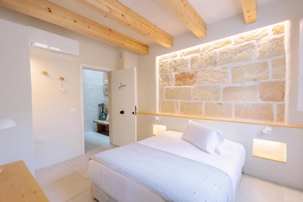 Ένα ή περισσότερα κρεβάτια σε δωμάτιο στο Marosi Boutique Hotel