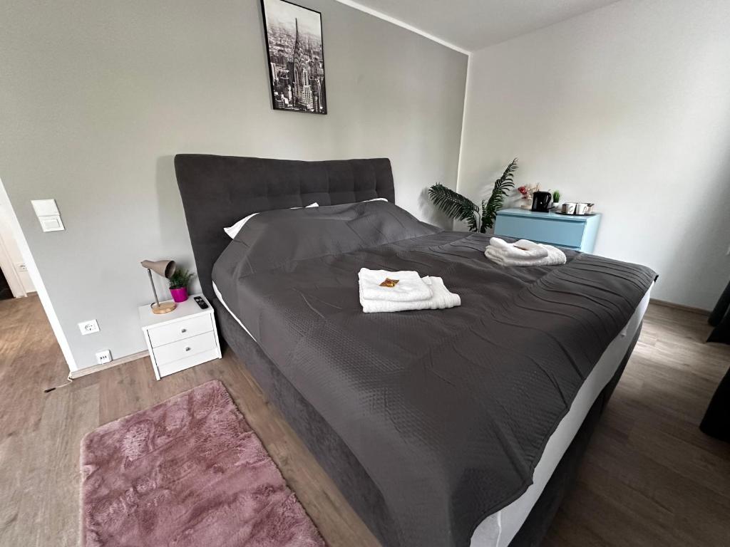 เตียงในห้องที่ Premium Apartments Schwetzingen, Heidelberg, Speyer