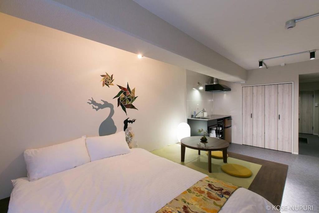 Giường trong phòng chung tại bHOTEL Origaminn 303 - 5 mins PeacePark