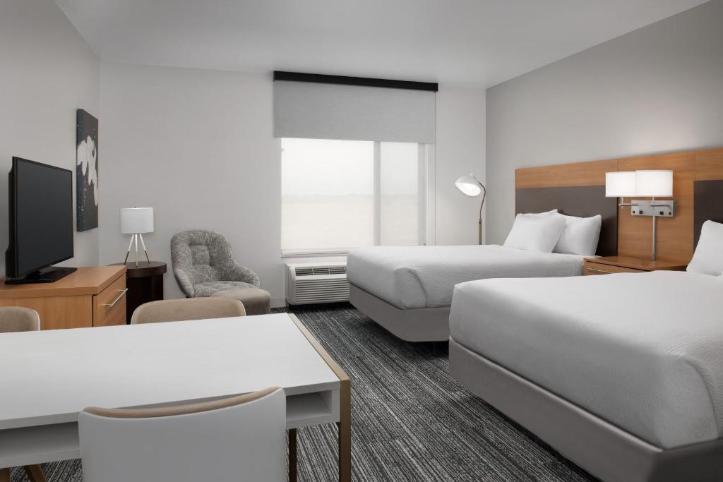 Postelja oz. postelje v sobi nastanitve TownePlace Suites by Marriott Cheyenne Southwest/Downtown Area