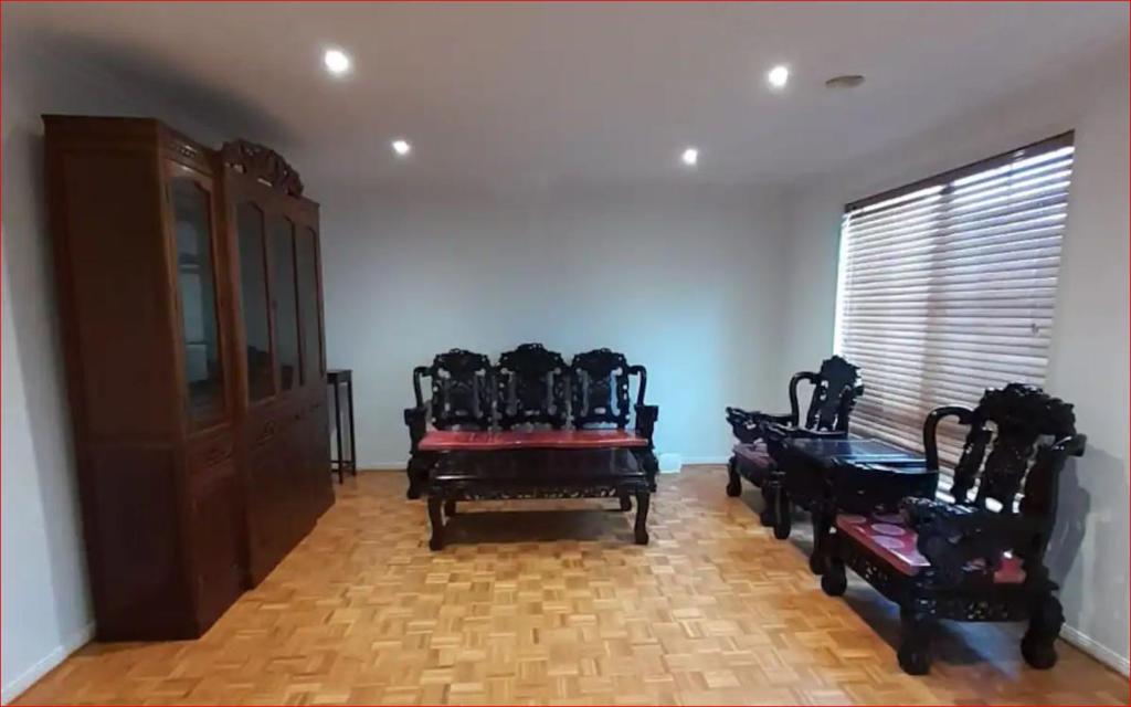 a room with chairs and a table and a window at A Unique Holiday Home between Avalon Airport and Melbourne CBD in Werribee