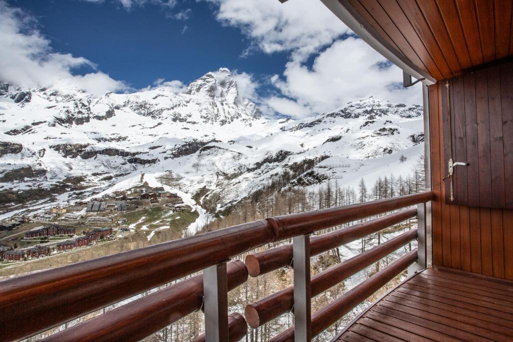 a balcony with a view of a snow covered mountain at Marcolski home in Breuil-Cervinia