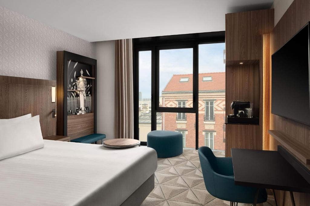 Cama ou camas em um quarto em Courtyard by Marriott Paris Porte de Versailles