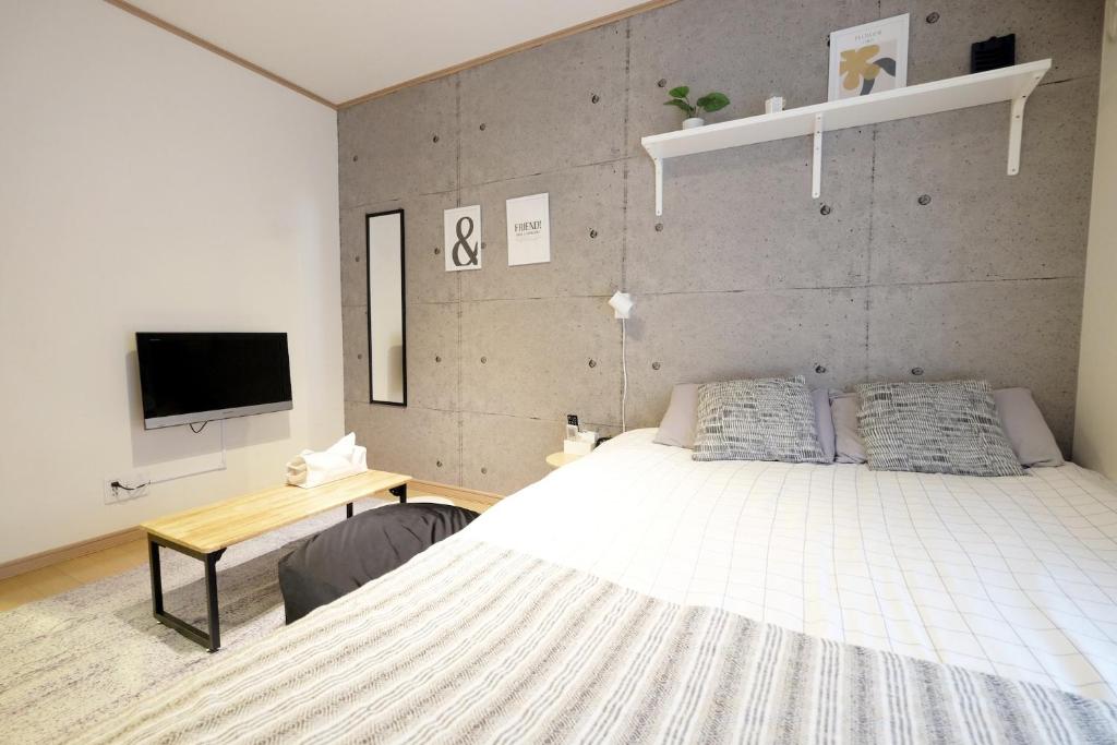 Cama ou camas em um quarto em Daiichi Mitsumi Corporation - Vacation STAY 15270