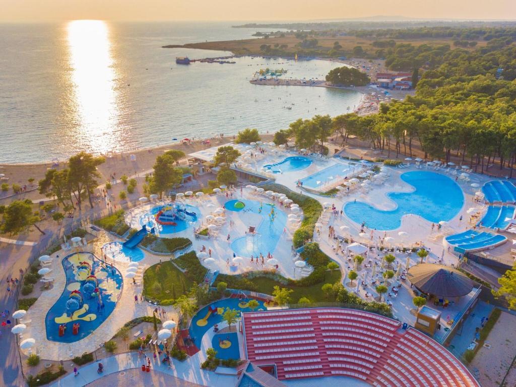 an aerial view of the water park at a resort at Mobile homes in Zaton Holiday Resort, with large pool area in Zaton