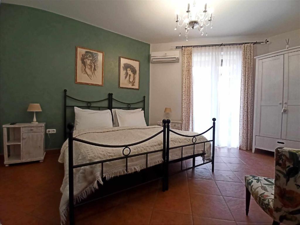 Cama ou camas em um quarto em Villa Toscana