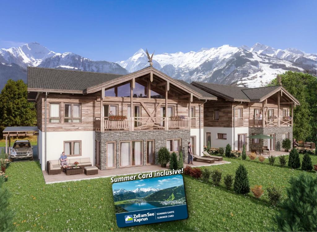 ツェル・アム・ゼーにあるGrossglockner Chalets Zell am Seeの山を背景とした家屋