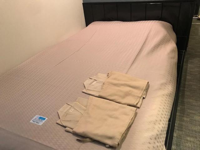 Tempat tidur dalam kamar di Urbain Hiroshima Executive