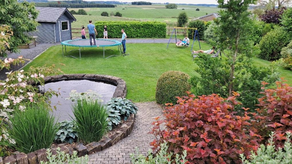 a group of people playing in a garden at Bonheur à la campagne in Bastogne