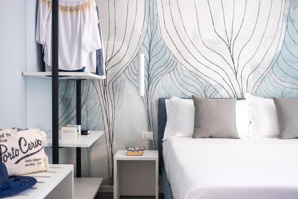 a bedroom with a bed and a wall mural at Residence Lido di Dante in Lido di Jesolo