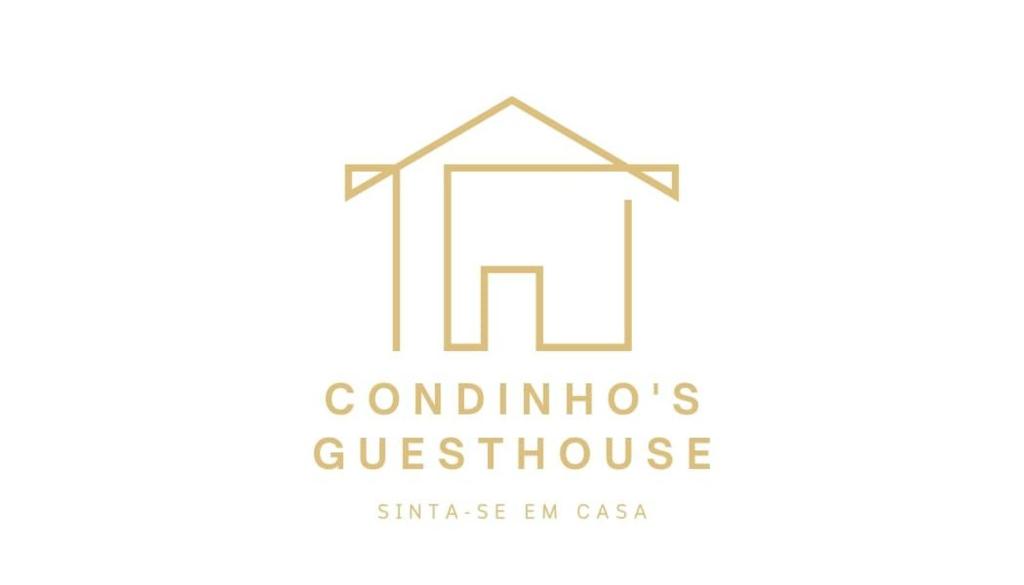 古勒冈Condinho's Guest House的房屋建筑业标志