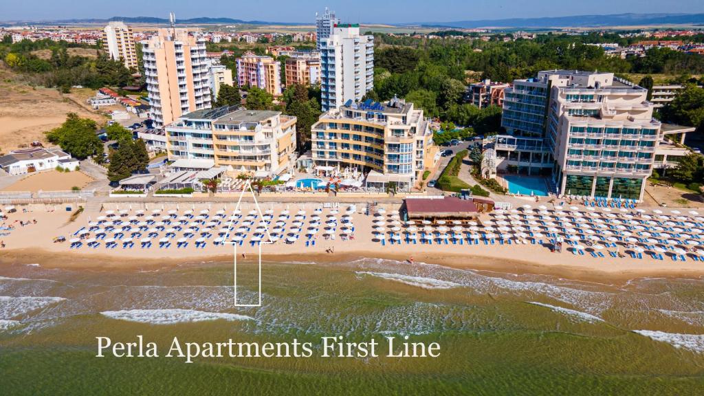 an aerial view of a beach with umbrellas at Perla Apartments First Line in Nesebar