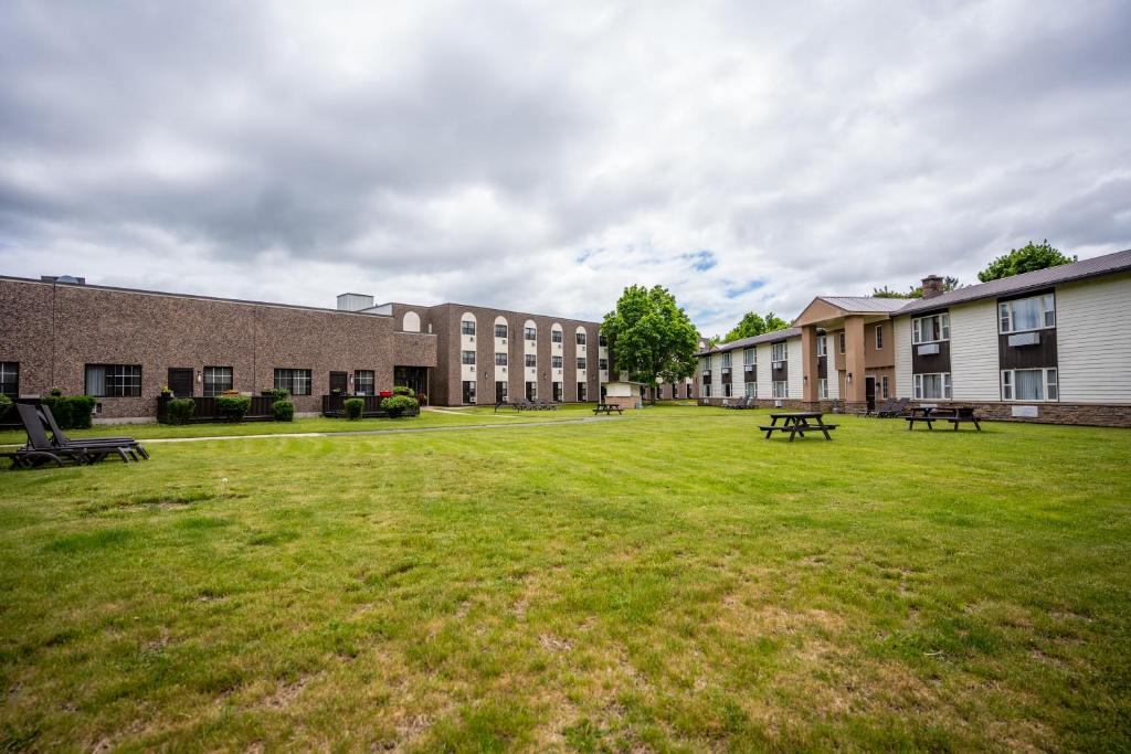 a large grassy yard in front of a building at Glengarry Extended Stays in Truro